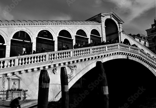 Venice, Italy, December 28, 2018 evocative black and white image of the Rialto Bridge, one of the best known symbols of the city