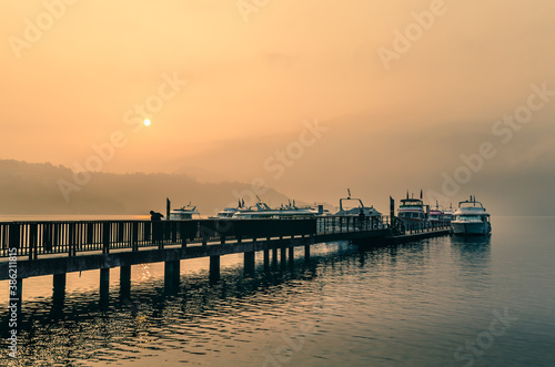 Beautiful sun rise scene of boats at pier at Sun Moon Lake  Taiwan.