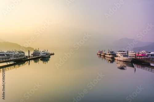 Beautiful sun rise scene of boats at pier at Sun Moon Lake, Taiw