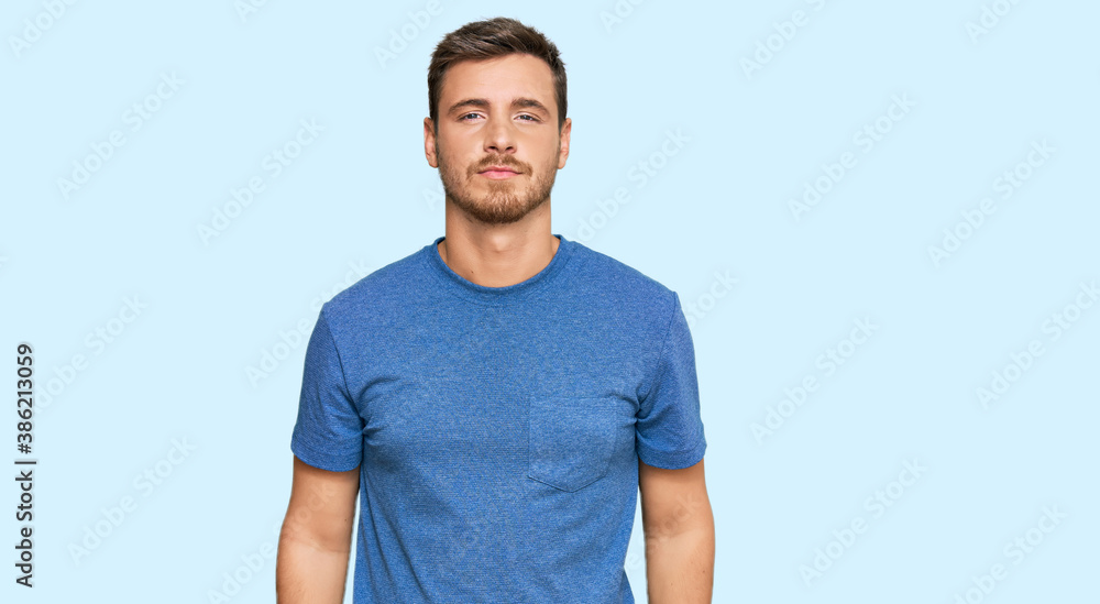 Fototapeta premium Handsome caucasian man wearing casual clothes relaxed with serious expression on face. simple and natural looking at the camera.