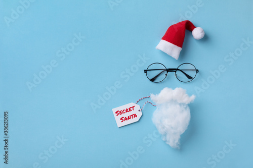 Santa Claus hat, glasses and beard. Christmas or New year greeting card. Secret Santa concept. photo