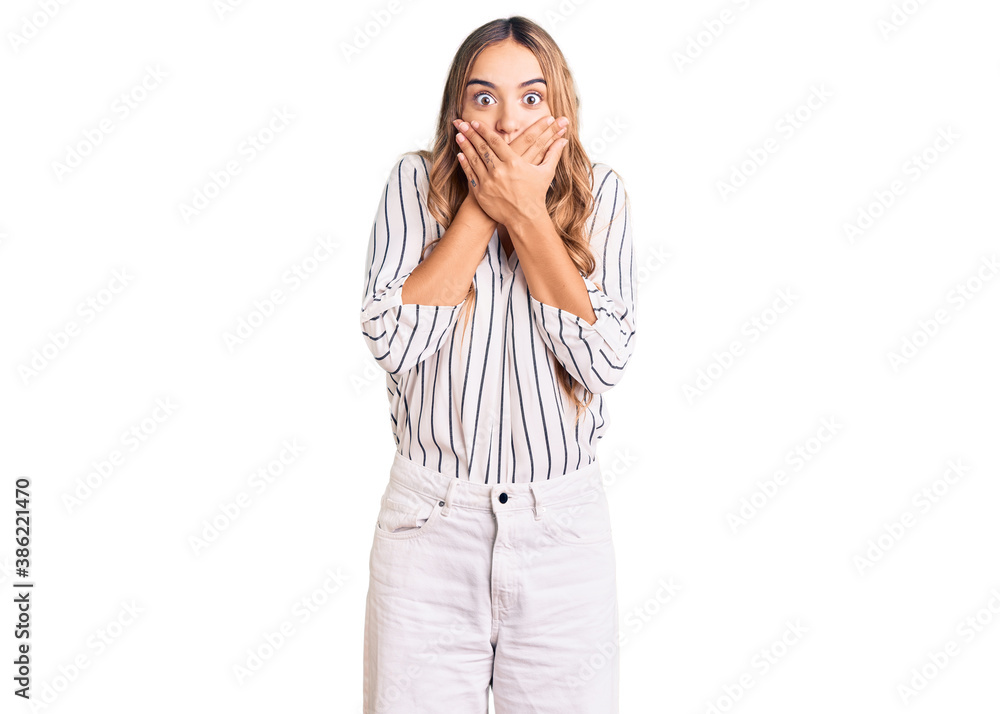 Young beautiful blonde woman wearing casual clothes shocked covering mouth with hands for mistake. secret concept. Young beautiful blonde woman wearing casual clothes shocked covering mouth with hands for mistake. secret concept.