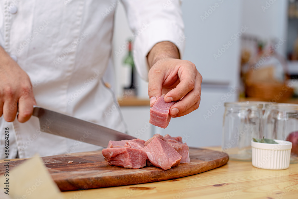 chef cutting meat