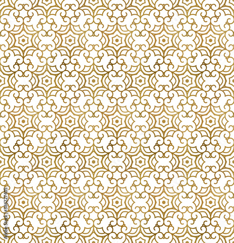 Traditional arabesque seamless pattern. Repeatable background of golden shapes and lines. © PerepadiaY