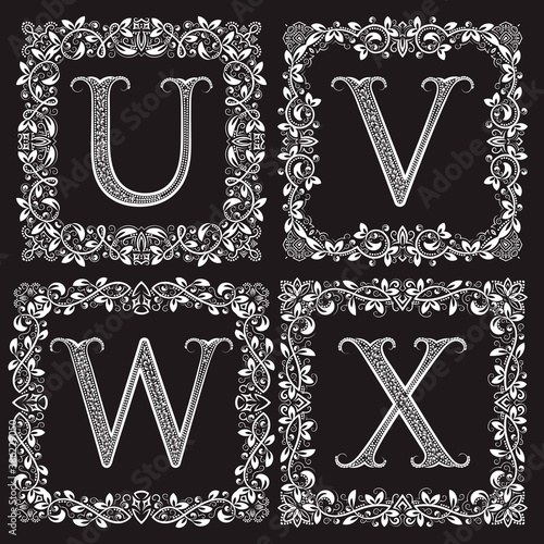 Decorative ornate monograms set. U, V, W, X vintage letters in square floral frames.
