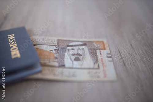 Ten Saudi Riyals Bill Partially Inside a United States of America Passport