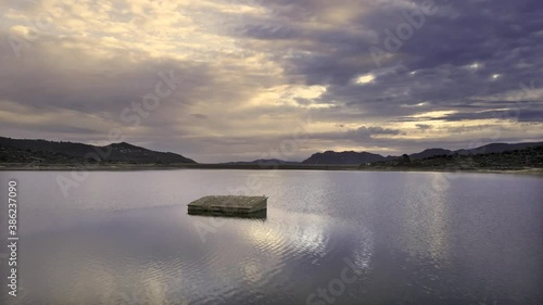 Early morning view of an abandoned building submerged under the Lac de Codole in the Regino Valley in the Balagne region of Corsica photo