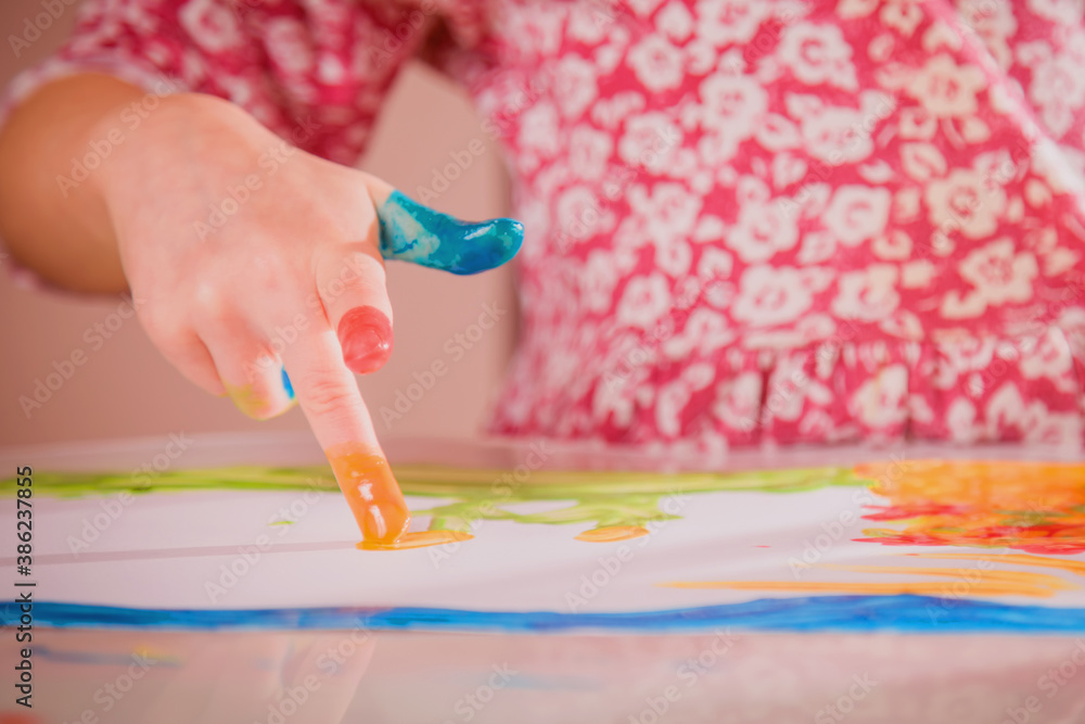 Close up hands of young beautiful girl with paints. Art, painting lessons and process. Selective focus on finger. Close up hands of young beautiful girl with paints. Art, painting lessons and process. Selective focus on finger.