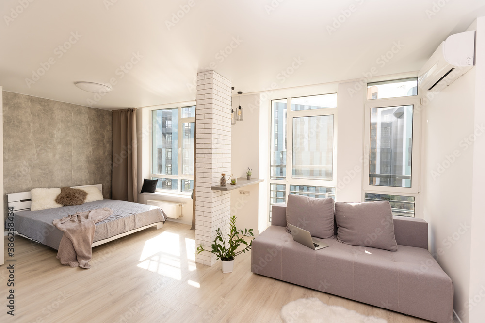 Fototapeta premium Modern minimalist design of bright living room