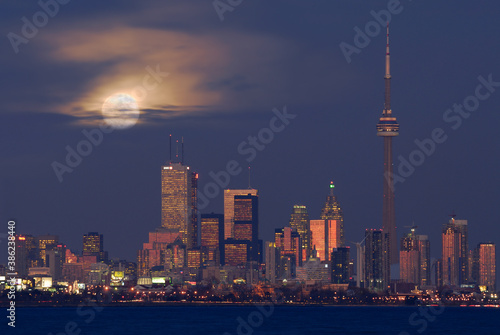 Toronto city skyline at dusk with moonrise