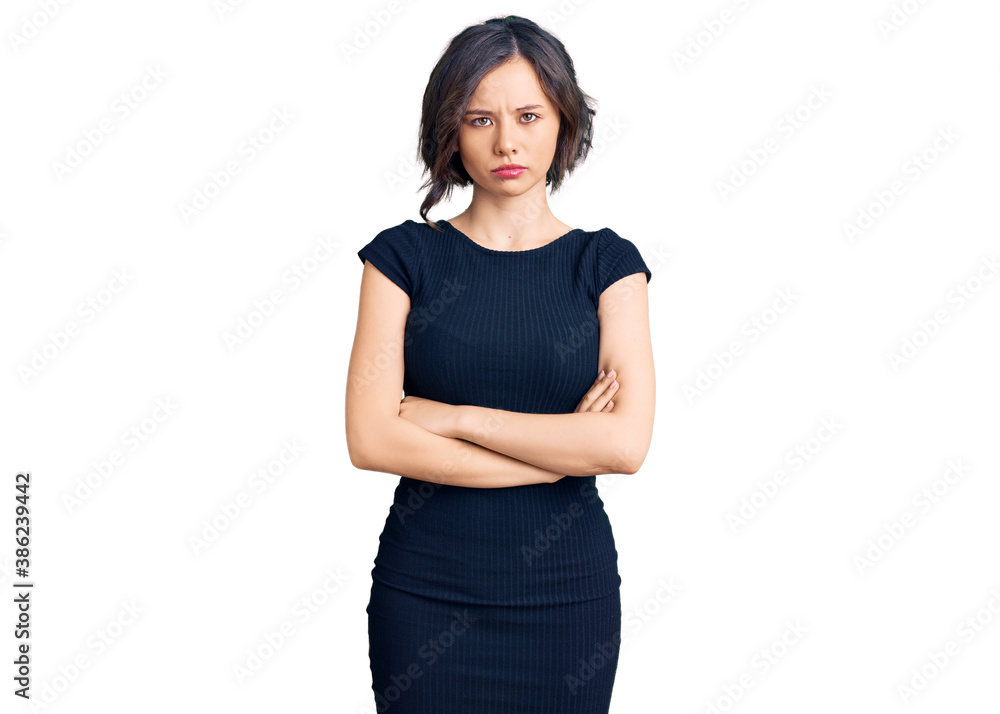 Young beautiful girl wearing casual clothes skeptic and nervous, disapproving expression on face with crossed arms. negative person. Young beautiful girl wearing casual clothes skeptic and nervous, disapproving expression on face with crossed arms. negative person.