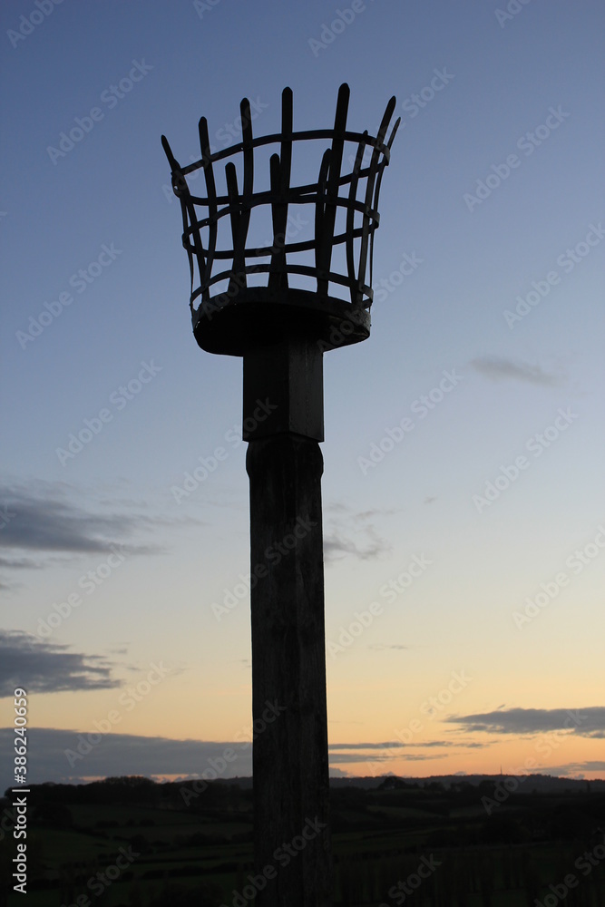 Beacons or fire beacon are a warning signal system of historical Uk lit on hills in coastal areas of England and Scotland to signal invading lit in medieval Beacons or fire beacon are a warning signal system of historical Uk lit on hills in coastal areas of England and Scotland to signal invading lit in medieval