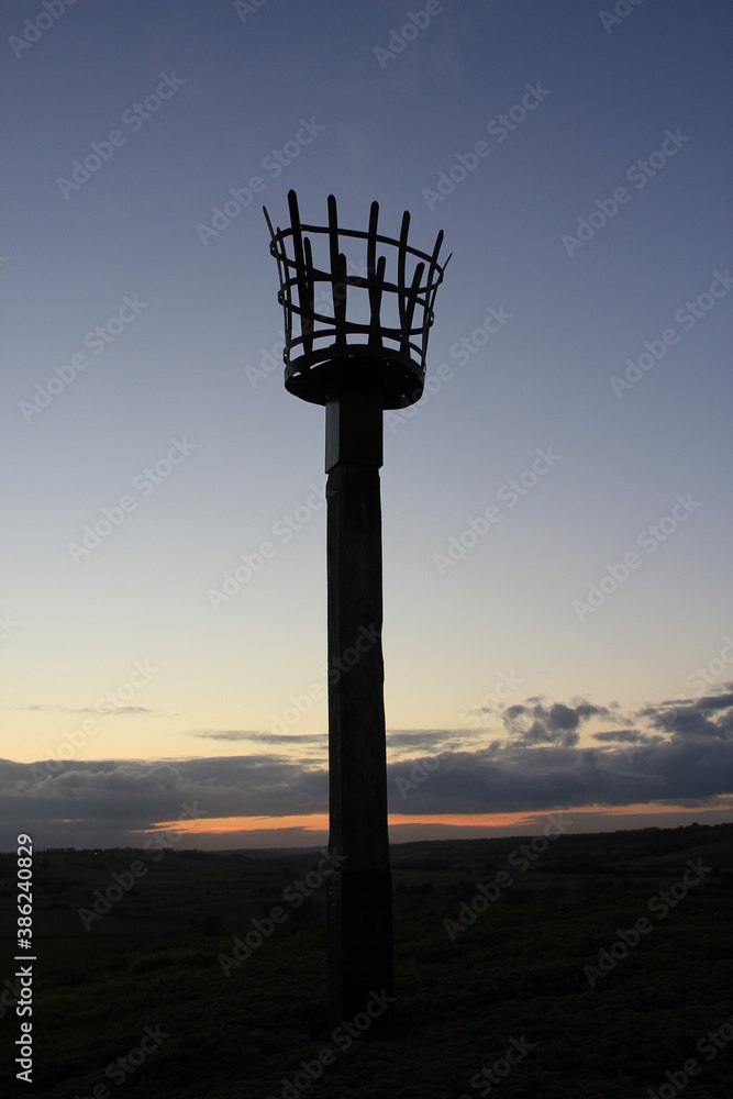 Beacons or fire beacon are a warning signal system of historical Uk lit on hills in coastal areas of England and Scotland to signal invading lit in medieval Beacons or fire beacon are a warning signal system of historical Uk lit on hills in coastal areas of England and Scotland to signal invading lit in medieval