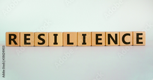 'Resilience' written on wood blocks. Business concept. Copy space. Beautiful white background.