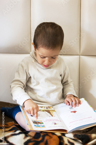 Little child learns to read