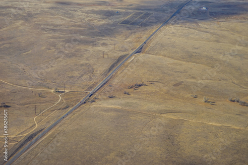 Aerial view of of farm in suburban of Denver in Colorado and the country road 
 photo