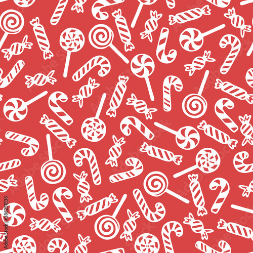 Vector seamless pattern with hand drawn lollipops, candy canes and candies. Cute design for Christmas wrappings, textile and backgrounds