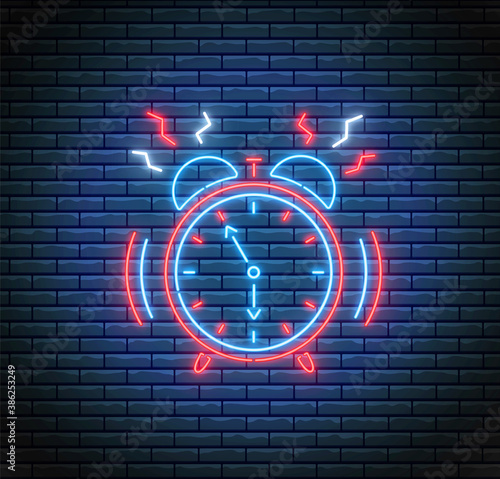 Ringing alarm clock in neon style. Vector. Time concept. Led light illustration. Timer on brick wall. Glowing watch. Fluorescent design.