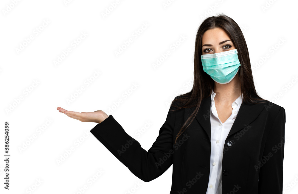 Smiling businesswoman isolated on white wearing a mask, coronavirus concept, with open hand for welcoming or advertising concepts Smiling businesswoman isolated on white wearing a mask, coronavirus concept, with open hand for welcoming or advertising concepts