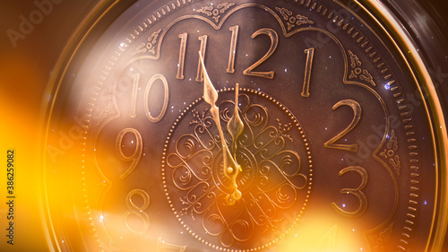 The clock shows the time. Classic watch, close-up. Glow bokeh.