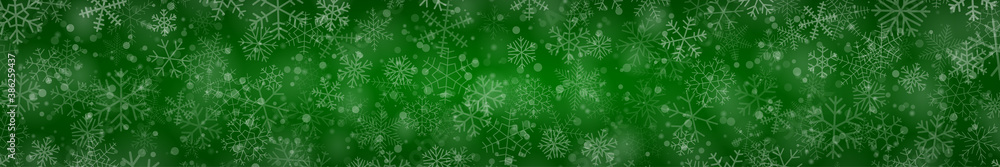 Christmas banner of snowflakes of different shapes, sizes and transparency on green background Christmas banner of snowflakes of different shapes, sizes and transparency on green background