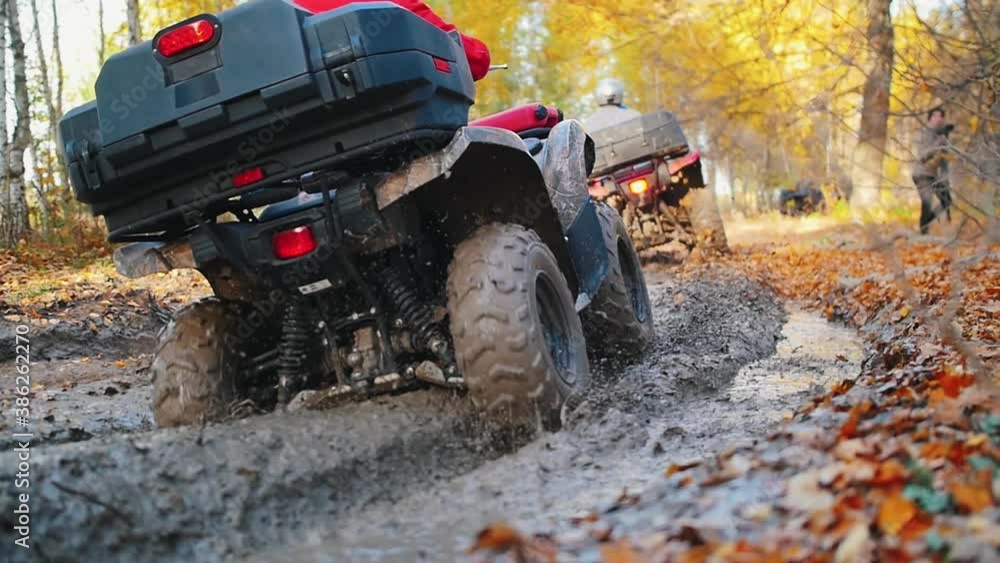 Wideo Stock Outdoor activity people riding ATVs in the forest ride