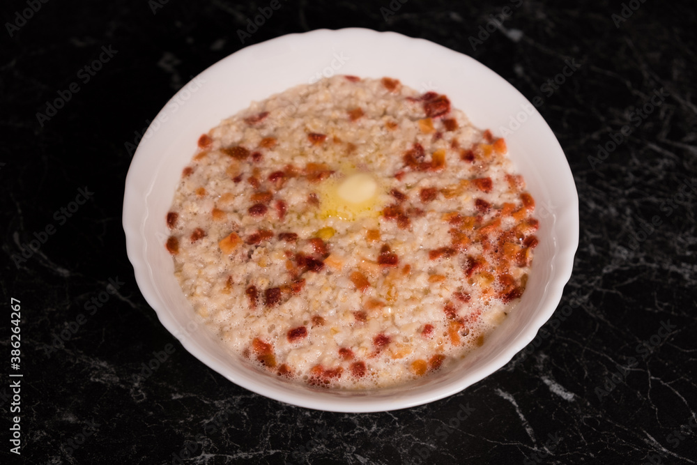 Bowl of homemade oatmeal, hot and healthy food for Breakfast Bowl of homemade oatmeal, hot and healthy food for Breakfast