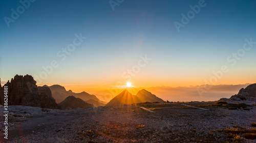 panoramic view at sunrise over the mountain ranges of the dolomites