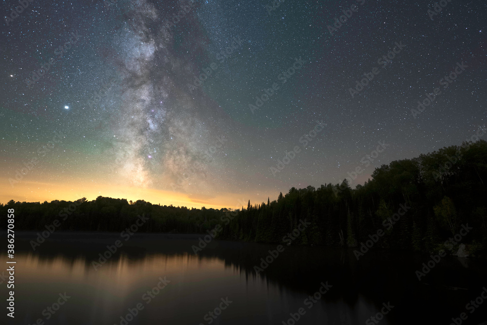 The Milky Way Rises Over A Lake In Algonquin Park, Canada