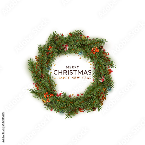 Christmas wreath realistic pine branches. Decorative design elements of berries, candy cane, bauble balls. Xmas decorate. Holiday background. Round frame made of natural winter decor things. Flat lay.