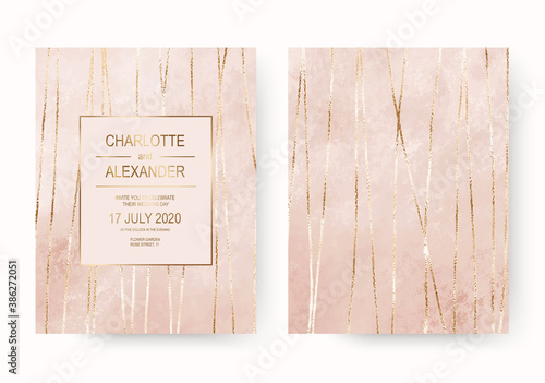 Elegant pink wedding invitation cards with gold foil stripes.