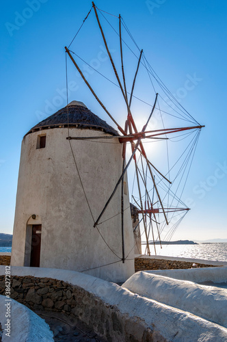 windmills in Mykonos shot against the sun