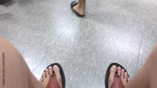 Time lapse patient sits on the wheelchair and moves along in corridor of the hospital. Emergency room