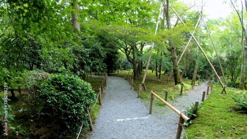 Video of walking along gravel path through the traditional Japanese moss and stones garden of Ryoan-ji temple. Kyoto. Japan. photo