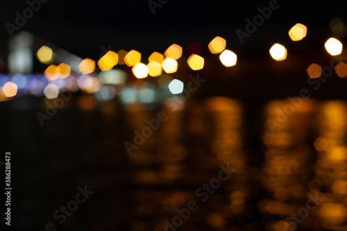 Night city in beautiful lanterns. Suitable for backgrounds and various purposes © Evgenii Potekhin