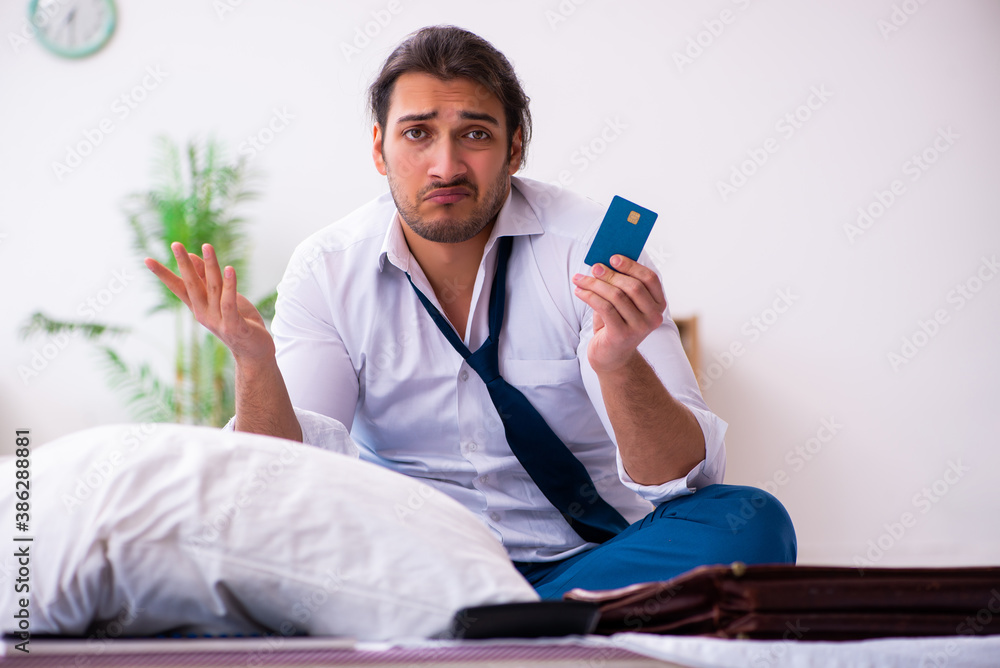 Young male employee working from home during pandemic Young male employee working from home during pandemic