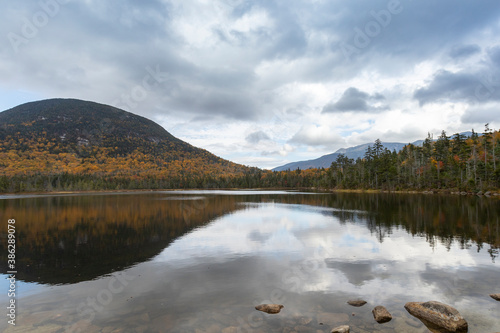 Franconia Ridge and Cannon Mountain's southern edge stand tall from the soutern shore of Lonesome Lake photo