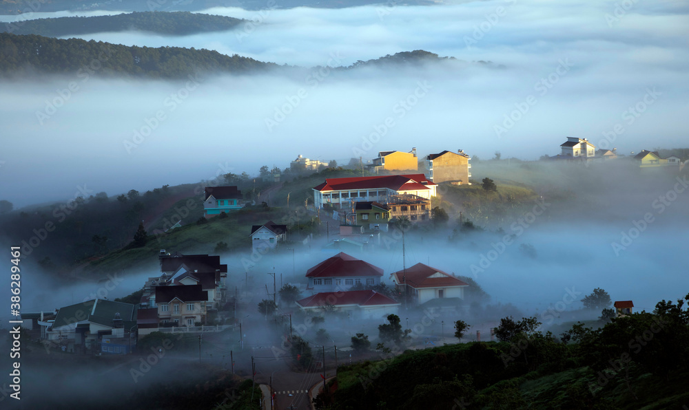 Fototapeta premium Small town in the clouds