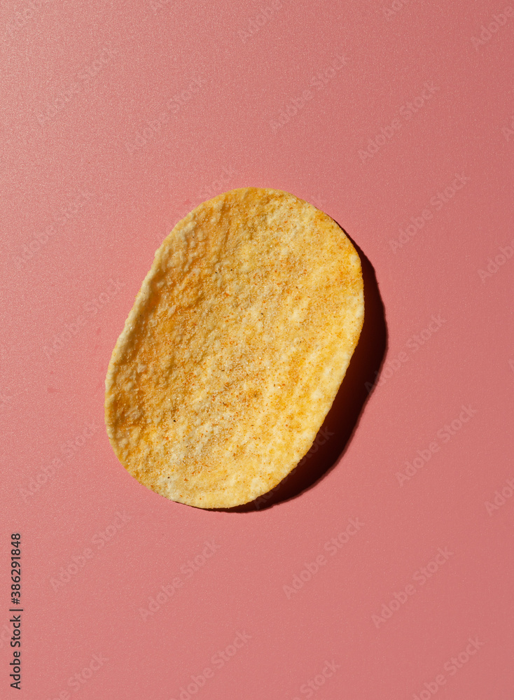 Broken yellow cookie with chocolate on pink background. Top view. Broken yellow cookie with chocolate on pink background. Top view.