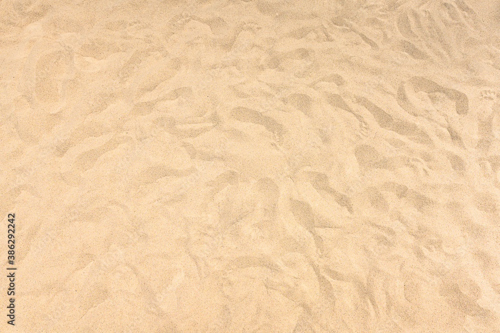 background and texture of yellow sand pattern on a beach in summer background and texture of yellow sand pattern on a beach in summer