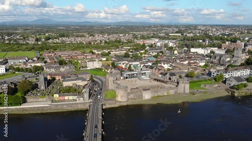 King John's Castle on King's Island, Limerick City, Ireland.  Drone Aerial View of Landmark and Cityscape by Shannon River on Summer Day photo