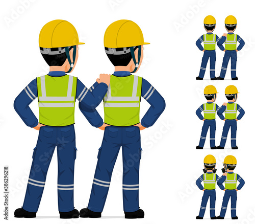 Two industrial worker standing together on white background