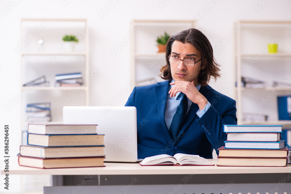 Young businessman student studying at workplace Young businessman student studying at workplace