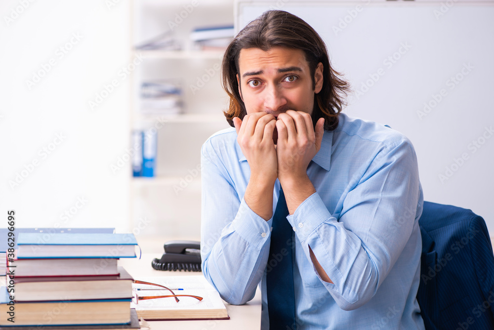 Young businessman student studying at workplace Young businessman student studying at workplace