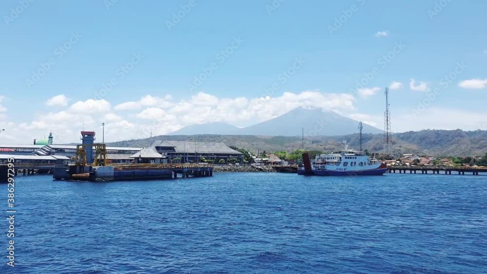 Beautiful scenery from a ferry with misty mountain Beautiful scenery from a ferry with misty mountain