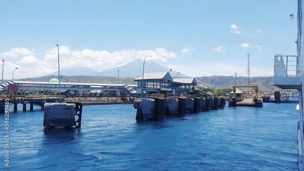 Ferry leaving Ketapang Harbour with misty mountain Ferry leaving Ketapang Harbour with misty mountain