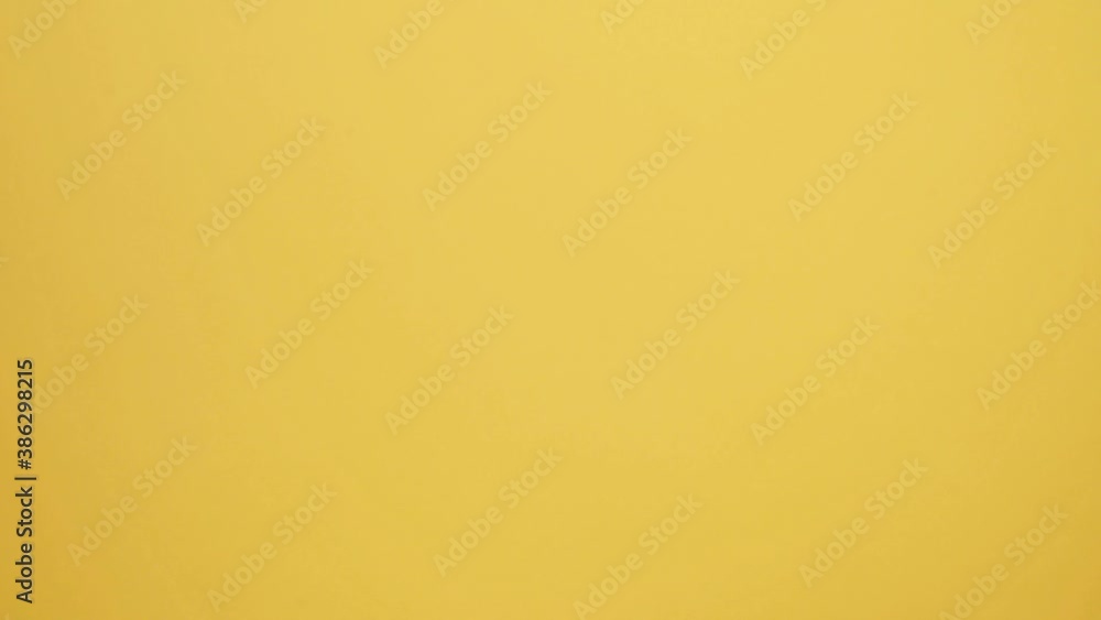 Close up hands wearing medical rubber glove giving the present gift box in christmas day on yellow background. Merry christmas and happy new years and sending the gift. 4K Resolution. Close up hands wearing medical rubber glove giving the present gift box in christmas day on yellow background. Merry christmas and happy new years and sending the gift. 4K Resolution.