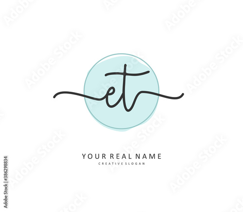 E T ET Initial letter handwriting and signature logo. A concept handwriting initial logo with template element.