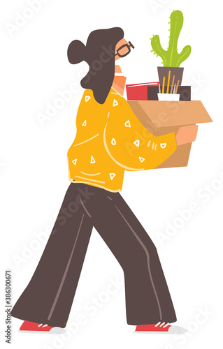 Woman wearing mask carrying box with personal belongings