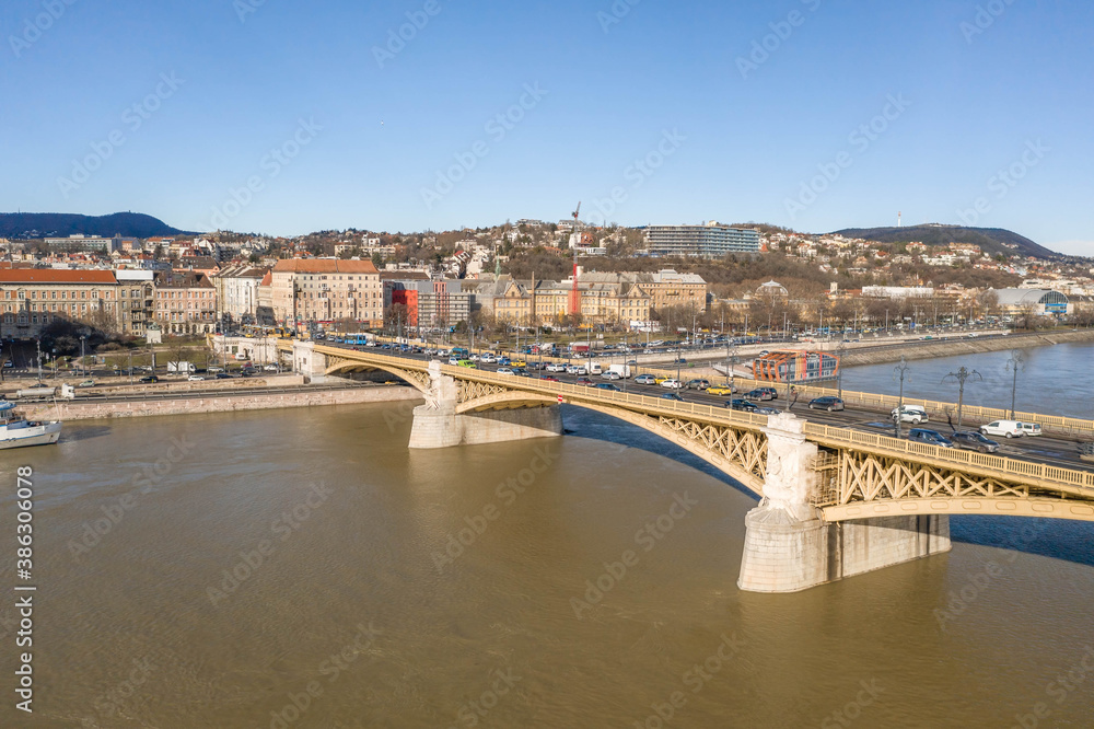 Aerial drone shot of Margret Bridge over Danube in Budapest winter morning with overcast